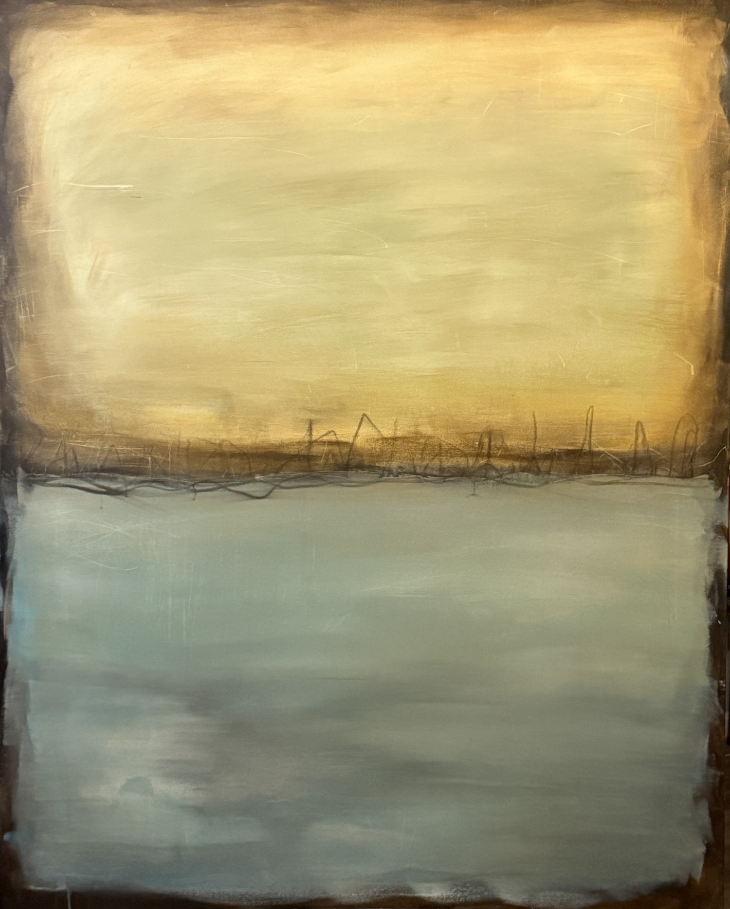 Abstract painting with a warm beige and golden brown upper section, a cool blue‑gray lower section, and a dark jagged horizon line with subtle vertical marks.