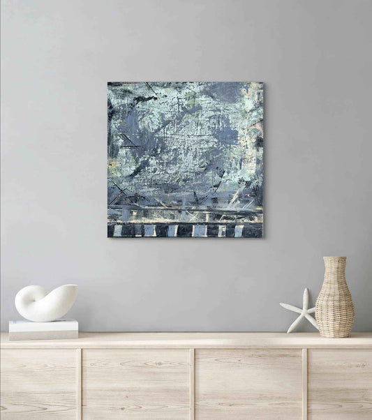 "Baby Blue" 20x20 abstract mixed media painting by Michelle Ramos displayed on a light gray wall in a modern interior setting