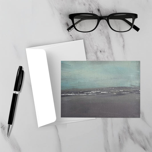 Minimal abstract artwork displayed unframed in a modern interior, featuring soft blue‑gray tones and gentle misty movement for a calm, atmospheric feel.